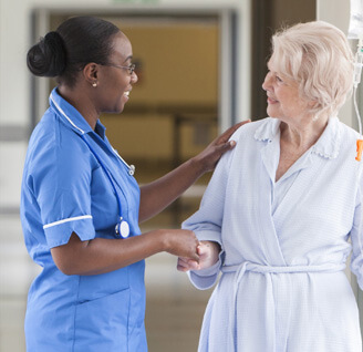 Home nurse helping older woman