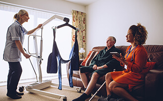 Nurse instructing couple on how to use machine